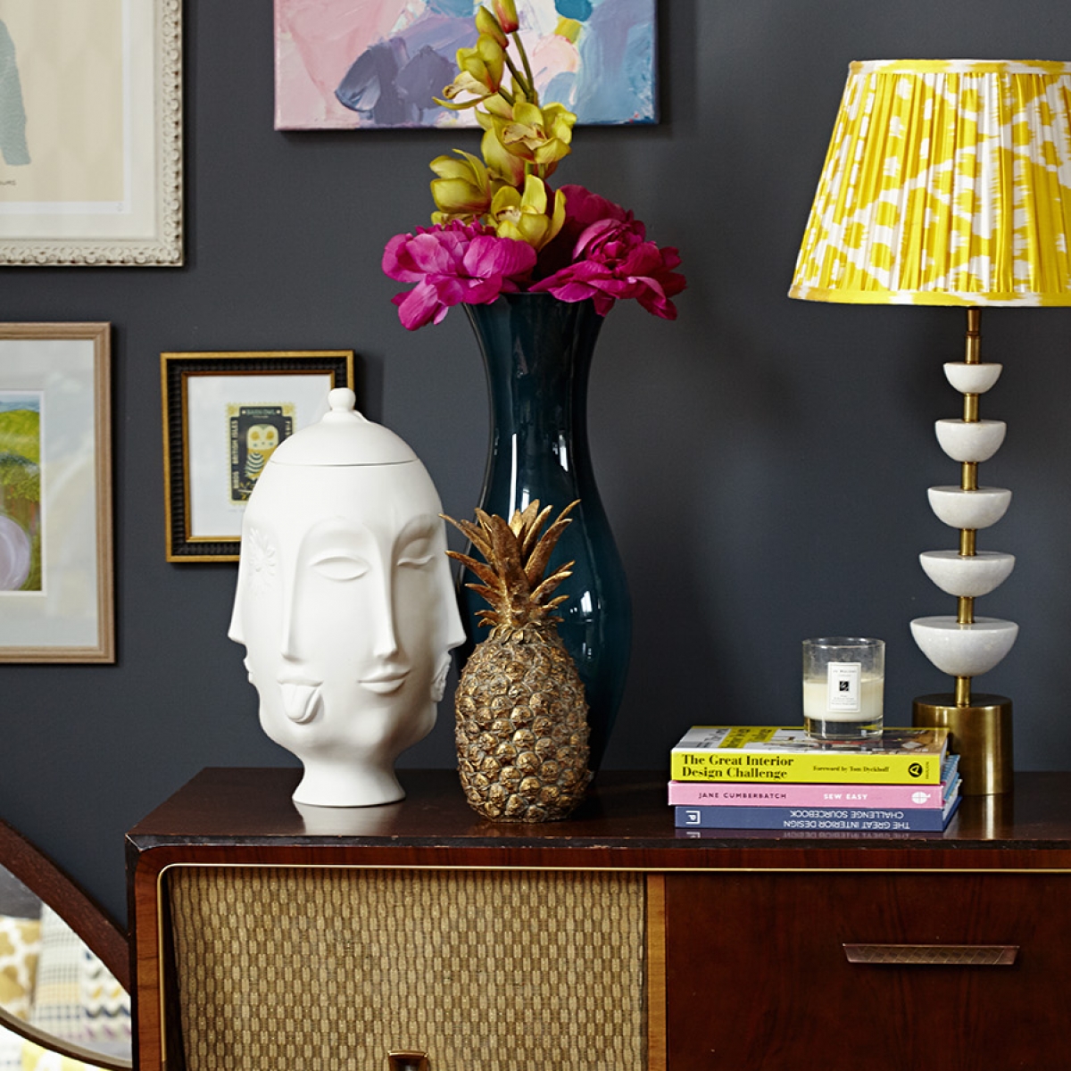 Styled objects on a vintage radio gram in the home of Sophie Robinson