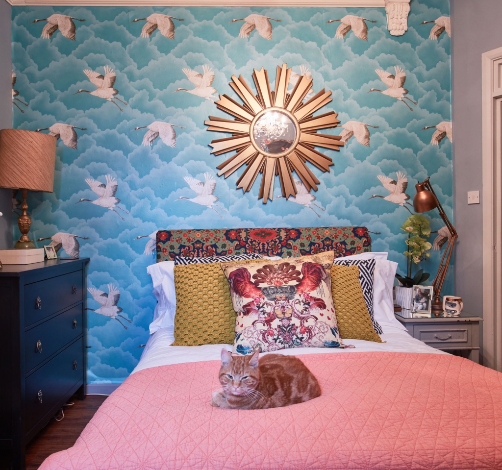 Maximilast bedroom with crane wallpaper and coral accents in the home of interior designer Oliver Thomas, finalist of The Great Interior Design Challenge. Full tour over on www.sophierobinson.co.uk
