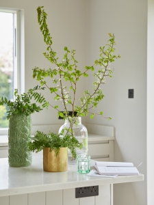 Interior designer Sophie Robinson styling La Redoute vases and foliage