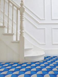Interior Designer Sophie Robinson chooses favourite encaustic cement tiles bright blue hallway floor