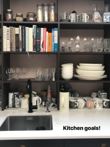 Interior Designers Sophie Robinson talks kitchen update with organised kitchen shelves above the sink