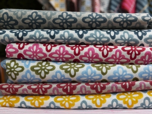 Interior Designer Sophie Robinson interviews textile and wallpaper designer Molly Mahon - pile of colourful Pattee fabrics