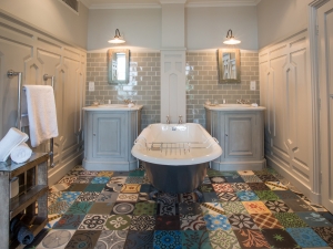 Interior Designer Sophie Robinson talks about Why Staying in is the new going out, The Pig Hotel patchwork tiled bathroom floor