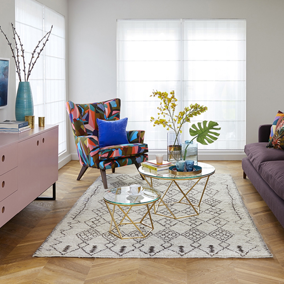 Interior designer Sophie Robinson design living room for Ideal Home Show gallery wall and pale pink sideboard and Quick-Step Intenso herringbone floor