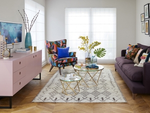 Interior designer Sophie Robinson design living room for Ideal Home Show gallery wall and pale pink sideboard and Quick-Step Intenso herringbone floor