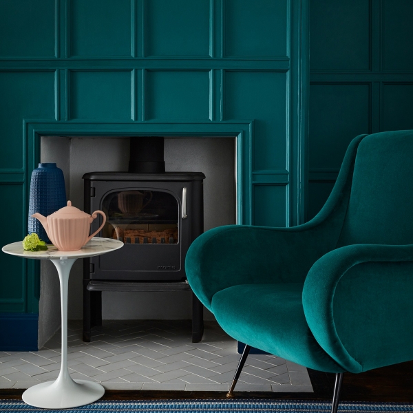 interior designer sophie robinson shows you how to decorate with teal, painted panelled wall and velvet armchair