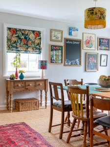 Another gallery wall in the renovated farmhouse by Jamies Farm. An eclectic mix of vintage dining chairs complete the dining area with a vibrant gallery wall. #sophierobinson #diningchairs #jamiesfarm