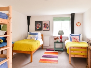 This colourful and cheerful kids bedroom is just part of the renovation by Jamie's farm charity. Suppliers and designers dedicated time and donated items for this worthy cause, including interior designer Sophie Robinson. #kidsbedroom #sophierobinson #renovation