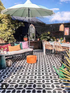 Interior designer Sophie Robinson and Kate Watson-Smyth discuss how to update the garden on the great indoors podcast - like this stencilled garden patio floor by #hayleystuart #thegreatindoors #gardenpatio #steniclledfloor