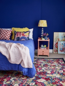 On the Great Indoors podcast Sophie Robinson and Kate Watson-Smyth look at ways to get the bedroom ready for winter and how colour affects our sleep. Blue is said to be the best colour for bedrooms, as seen in Sophie's bedroom the rich cobalt blue walls, colourful floral rug and patterned accessories create a striking yet restful scheme. #bedroom #cobaltblue #sophierobinson