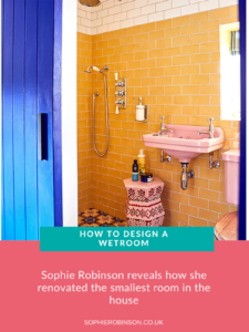 Sophie Robinson's wetroom with yellow wall tiles, pink basin and cobalt blue door.